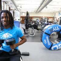 student working out in gym